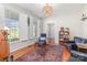 Cozy living room with large windows, hardwood floors, and comfortable seating at 214 Silver Creek Ln, Shelby, NC 28152