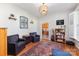 Comfortable living room with hardwood floors, bookshelves, and cozy seating at 214 Silver Creek Ln, Shelby, NC 28152