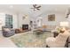 Inviting living room with vaulted ceiling, a brick fireplace, and a large, colorful rug at 214 Silver Creek Ln, Shelby, NC 28152