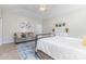 Relaxing main bedroom with a ceiling fan, sitting area, and neutral decor at 214 Silver Creek Ln, Shelby, NC 28152