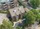 A captivating aerial view of the brick condo building with mature trees and lush surroundings at 2315 Selwyn Ave # F, Charlotte, NC 28207