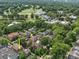 Lush green golf course in neighborhood with established trees, homes, and buildings at 2315 Selwyn Ave # F, Charlotte, NC 28207