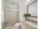 Bathroom featuring glass-enclosed shower, tiled walls, and vanity with peach-colored countertop at 2315 Selwyn Ave # F, Charlotte, NC 28207