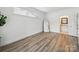 Bright bedroom featuring wood floors, and a large mirror at 2315 Selwyn Ave # F, Charlotte, NC 28207