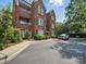 Elegant brick condo building featuring manicured landscaping and private balconies at 2315 Selwyn Ave # F, Charlotte, NC 28207