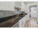 Kitchen featuring granite countertops, stainless steel appliances, and white cabinetry at 2315 Selwyn Ave # F, Charlotte, NC 28207