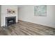 Bright living room with a marble fireplace, modern flooring, and contemporary artwork at 2315 Selwyn Ave # F, Charlotte, NC 28207