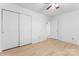 A bright bedroom with multiple closets, fresh paint, and modern flooring, offers ample storage and comfort at 2328 Danforth Ln, Charlotte, NC 28208