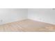 Empty bedroom features light wood floors, blank white walls and natural light at 2328 Danforth Ln, Charlotte, NC 28208