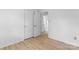 Sunlit bedroom with light wood floors, natural light through a window, and closet with a door at 2328 Danforth Ln, Charlotte, NC 28208