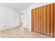 A light filled bedroom features a wall closet, wood-look flooring and door leading to adjacent space at 2328 Danforth Ln, Charlotte, NC 28208