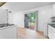 Bright kitchen with white appliances and a sliding glass door offering a view of the backyard at 2328 Danforth Ln, Charlotte, NC 28208