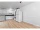 Cozy living room with wood floors, a door and view to the kitchen at 2328 Danforth Ln, Charlotte, NC 28208