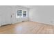 Bright living room boasts wood floors, a window bringing in natural light, and front door access at 2328 Danforth Ln, Charlotte, NC 28208