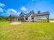 Exterior of the home showing the screened porch, back deck, and spacious backyard perfect for outdoor enjoyment at 2410 Charlotte Hwy, York, SC 29745