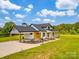 Charming home exterior featuring a covered carport, well-manicured lawn, and welcoming front entrance at 2410 Charlotte Hwy, York, SC 29745