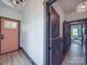 Inviting hallway featuring a charming front door, stylish interior doors, and wood-look flooring at 2410 Charlotte Hwy, York, SC 29745