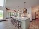 Spacious kitchen features an oversized island with bar stool seating and stylish pendant lighting at 2410 Charlotte Hwy, York, SC 29745