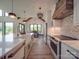 Modern kitchen features an island with a sink, white cabinets, and stainless-steel appliances at 2410 Charlotte Hwy, York, SC 29745