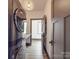 Well-lit laundry area showcasing modern washer/dryer, stylish light fixture, and convenient countertop space at 2410 Charlotte Hwy, York, SC 29745