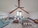 Bright living room with vaulted ceilings, exposed beams, a cozy seating area, and view of the backyard at 2410 Charlotte Hwy, York, SC 29745