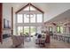 Bright and airy living room with a stone fireplace, vaulted ceilings, and expansive windows at 2410 Charlotte Hwy, York, SC 29745