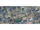 An aerial view shows the property amid the neighborhood's mature trees and well-maintained lawns at 245 Enwood Dr, Charlotte, NC 28214