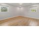 Sunlit bedroom features hardwood floors and windows, creating a warm and inviting space at 245 Enwood Dr, Charlotte, NC 28214