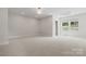 Bright and open bedroom with neutral carpet and recessed lighting at 245 Enwood Dr, Charlotte, NC 28214