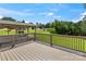 Spacious wooden deck offering a great view of the backyard and surrounding greenery at 245 Enwood Dr, Charlotte, NC 28214