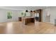 Modern kitchen with a center island, stainless steel appliances, and hardwood floors at 245 Enwood Dr, Charlotte, NC 28214