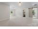 Bright and spacious main bedroom with a sliding barn door to the en-suite bathroom and a balcony at 245 Enwood Dr, Charlotte, NC 28214