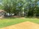 Spacious backyard with a newly constructed wooden deck and lush greenery at 2592 Tully Ct # 78, Lancaster, SC 29720