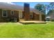 Brick house backyard featuring a new wooden deck and lush lawn at 2592 Tully Ct # 78, Lancaster, SC 29720