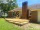 A recently installed wooden deck complementing a brick house in a green, grassy backyard at 2592 Tully Ct # 78, Lancaster, SC 29720