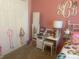Bright pink bedroom with desk, mirror and white closet at 2592 Tully Ct # 78, Lancaster, SC 29720