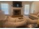 Cozy living room featuring a brick fireplace, plush seating, and ample natural light, perfect for relaxation at 2592 Tully Ct # 78, Lancaster, SC 29720