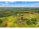 Aerial view of a sprawling property showcasing lush greenery, property lines and mature trees at 296 Hicks Creek Rd, Troutman, NC 28166