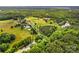 Aerial view of property highlighting boundaries surrounded by lush greenery and pond, offering privacy and natural beauty at 296 Hicks Creek Rd, Troutman, NC 28166