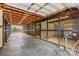 Interior view of barn featuring stalls with metal gates at 296 Hicks Creek Rd, Troutman, NC 28166
