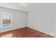 Bedroom featuring hardwood floors and a window that offers backyard views at 296 Hicks Creek Rd, Troutman, NC 28166
