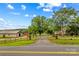 Property featuring a charming home with a well-maintained fence, outbuilding and gated entrance from the road at 296 Hicks Creek Rd, Troutman, NC 28166