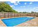Backyard pool with crystal clear water and a fenced-in yard for privacy at 296 Hicks Creek Rd, Troutman, NC 28166