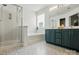Bright bathroom featuring a shower, bathtub, and vanity with double sinks and modern fixtures at 3005 Streamlet Way, Monroe, NC 28110