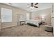 Cozy bedroom featuring natural light, ceiling fan and a desk/vanity area at 3005 Streamlet Way, Monroe, NC 28110
