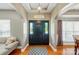 Elegant foyer with hardwood floors, arched doorways, and a stylish front door with sidelights at 3005 Streamlet Way, Monroe, NC 28110