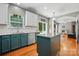 Open concept kitchen with island, stainless steel appliances and view of the living room at 3005 Streamlet Way, Monroe, NC 28110