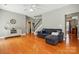 Spacious living room featuring hardwood floors, neutral walls, and staircase access to upper level at 3005 Streamlet Way, Monroe, NC 28110