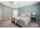 Comfortable main bedroom featuring a bed, tray ceiling and an ensuite bathroom with a soaking tub at 3005 Streamlet Way, Monroe, NC 28110