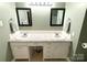 Bathroom featuring a double sink vanity with granite countertop and matching framed mirrors at 3158 Salisbury Hwy, Statesville, NC 28677